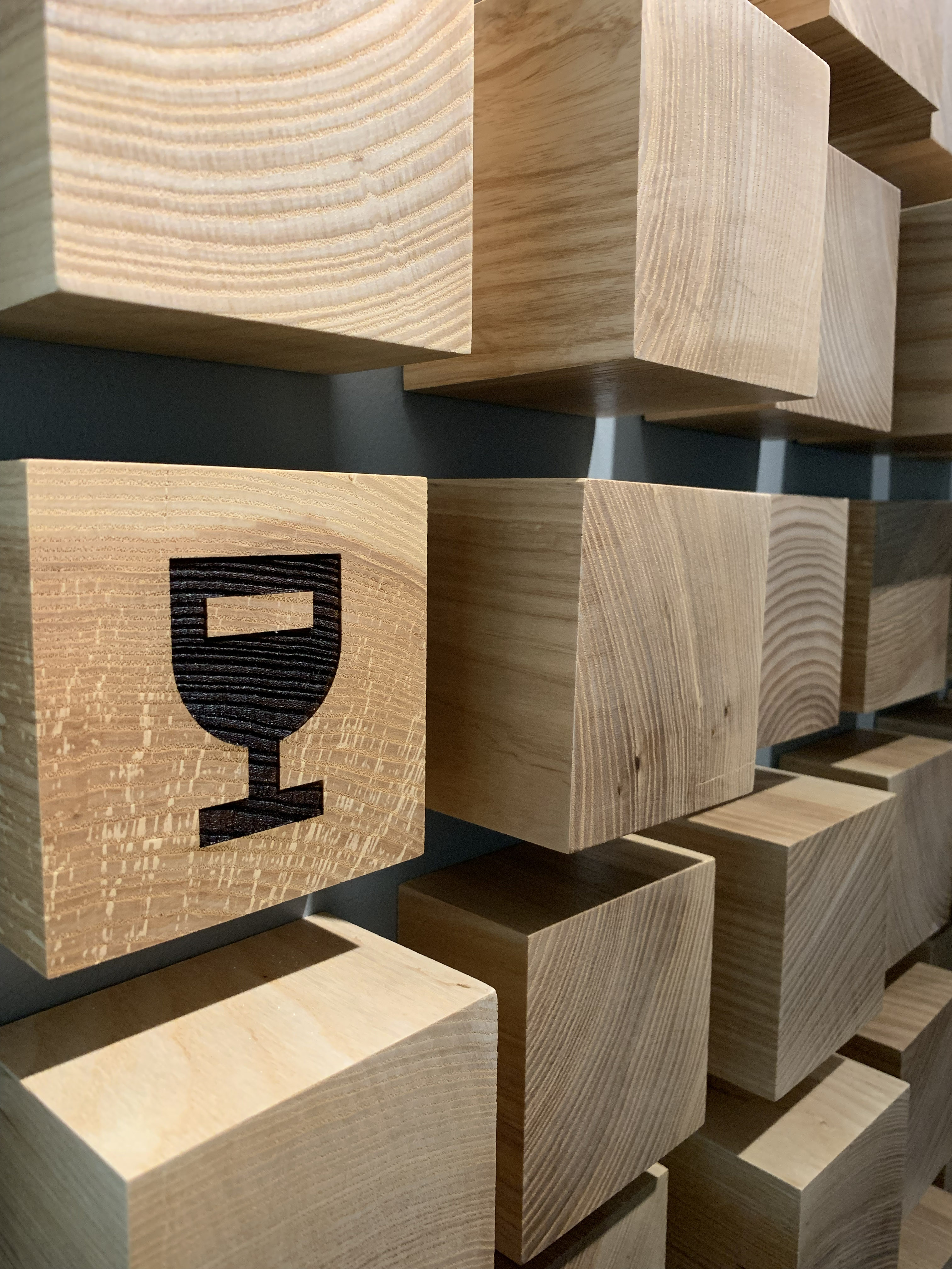 Wooden Block Wall Installation with Trophy Icon