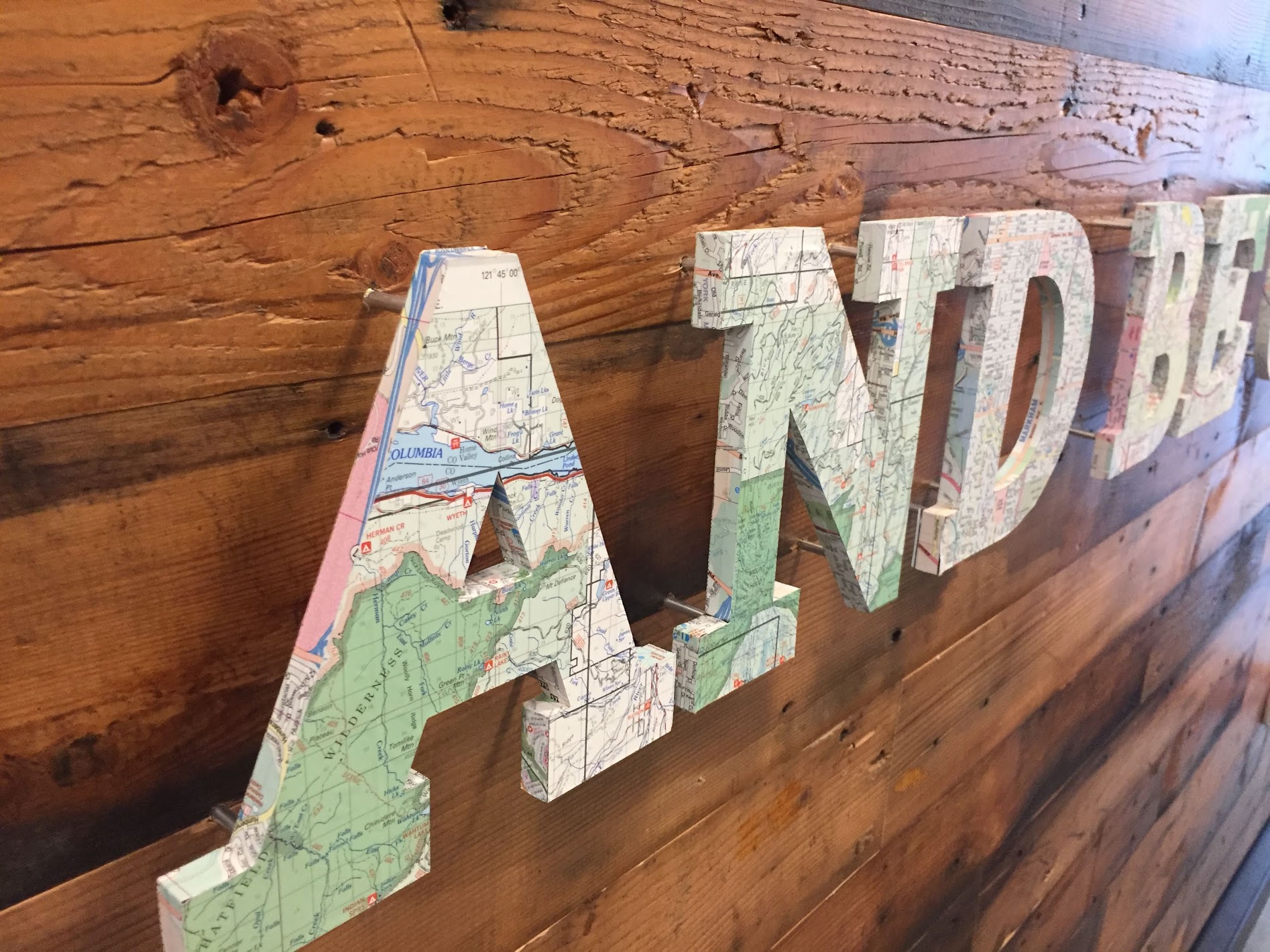 Map-Covered 3D Letters Installation